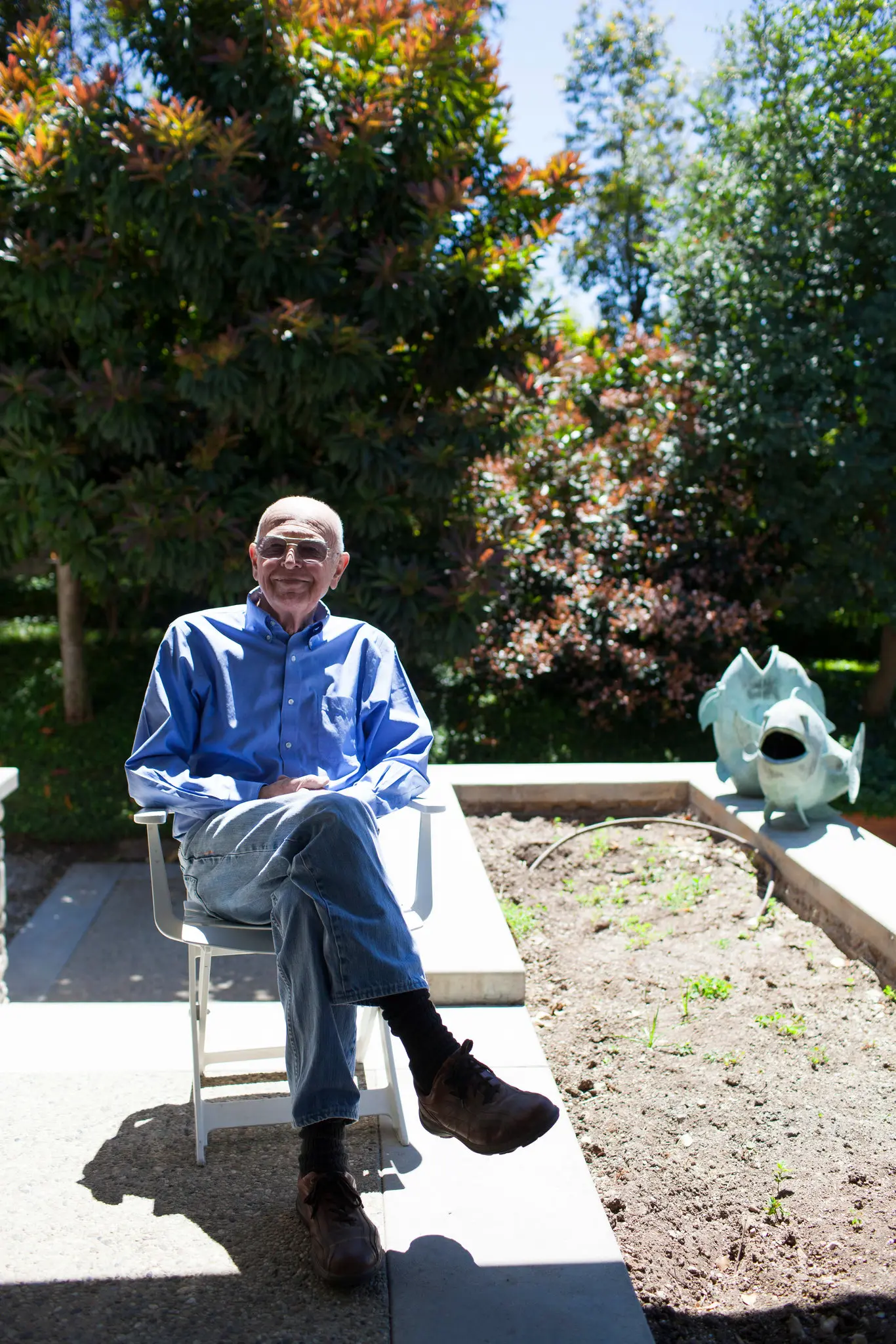 Joe Coulombe, founder of Trader Joe's, seated in his garden in Pasadena